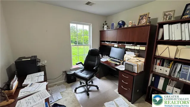 a bedroom with a bed and a lamp