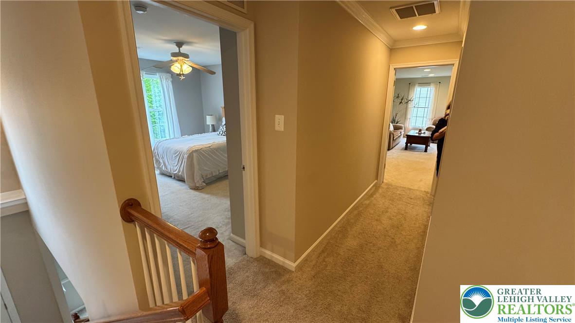 135 Clover Hollow Road Easton, PA 18045 - Photo 23 of 66 a view of a hallway with wooden floor and staircase