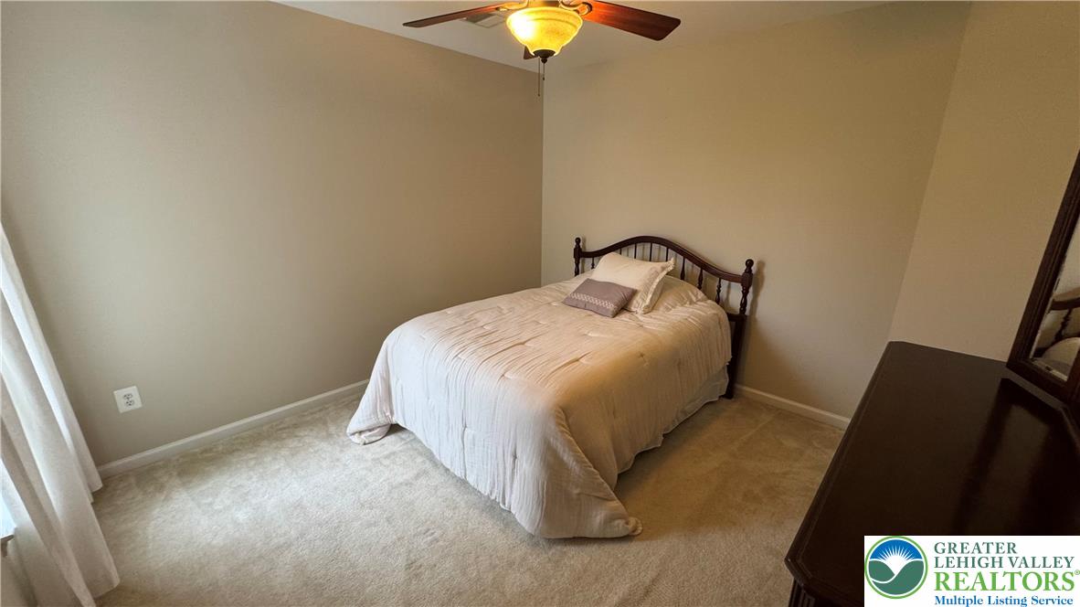 135 Clover Hollow Road Easton, PA 18045 - Photo 27 of 66 a bedroom with a bed and a lamp