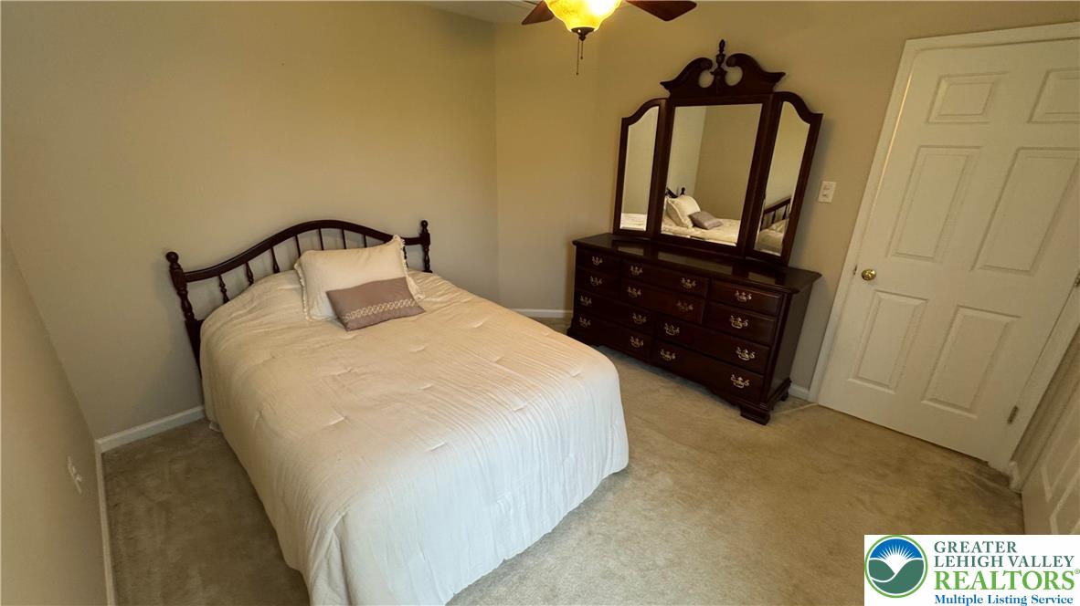 135 Clover Hollow Road Easton, PA 18045 - Photo 28 of 66 a bedroom with a bed and a mirror
