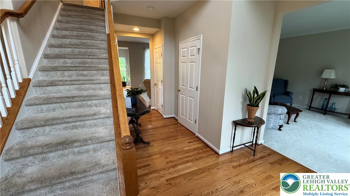 135 Clover Hollow Road Easton, PA 18045 - Photo 37 of 66 a view of a hallway with wooden floor and staircase