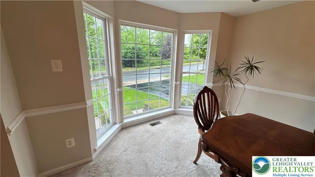 a kitchen with stainless steel appliances granite countertop a sink a stove and a wooden cabinets