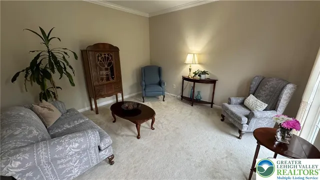 a kitchen with stainless steel appliances granite countertop a stove top oven a dining table and chairs with wooden floor