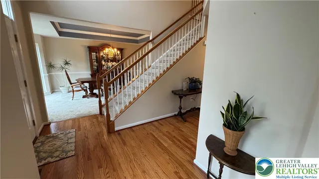 a kitchen with kitchen island granite countertop a stove a sink a dining table and chairs