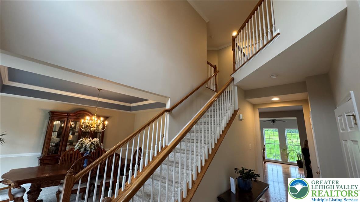 135 Clover Hollow Road Easton, PA 18045 - Photo 43 of 66 a view of staircase with lots of frames on wall and windows