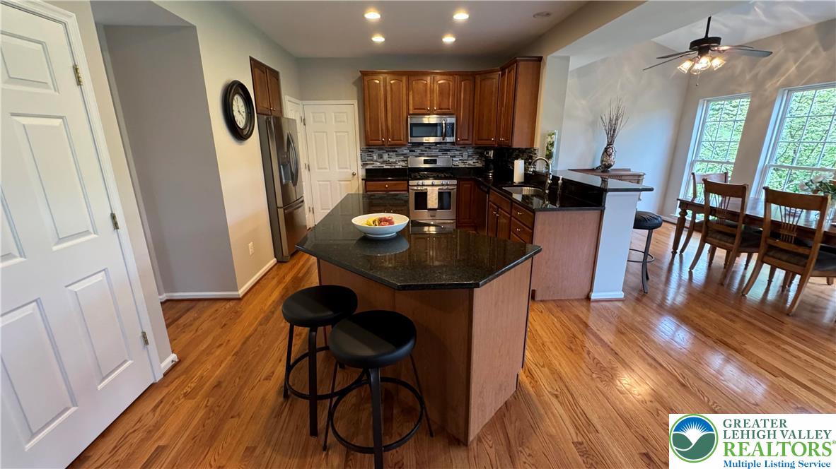 135 Clover Hollow Road Easton, PA 18045 - Photo 48 of 66 a dining room with furniture and wooden floor