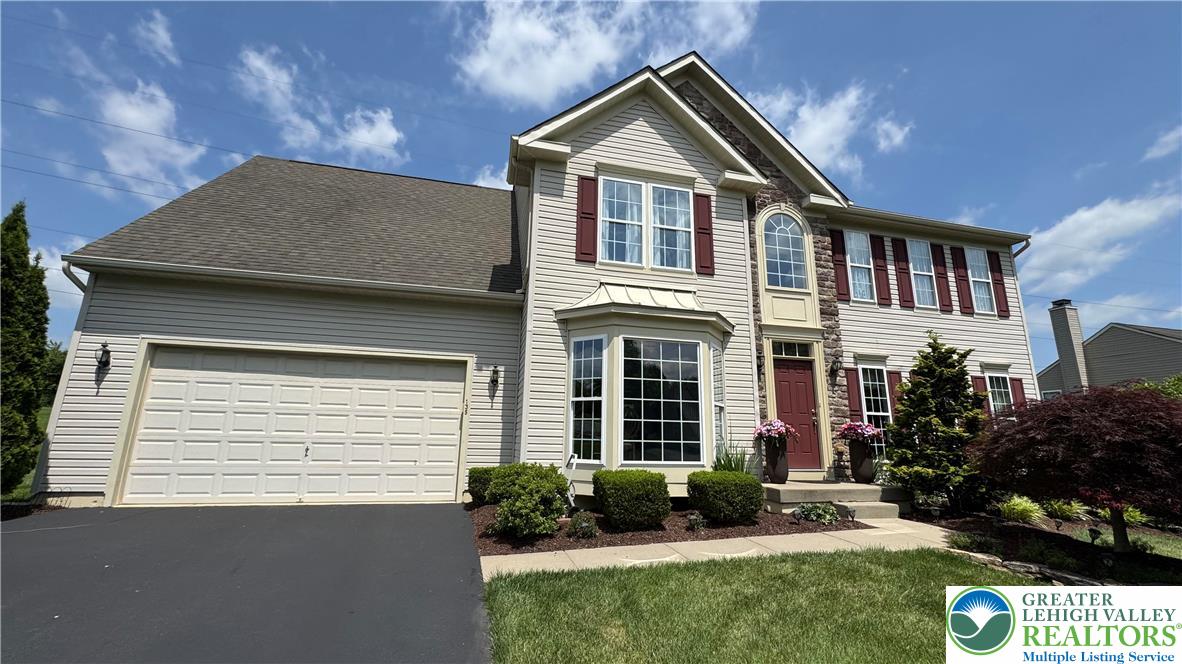 135 Clover Hollow Road Easton, PA 18045 - Photo 6 of 66 a front view of a house with a yard
