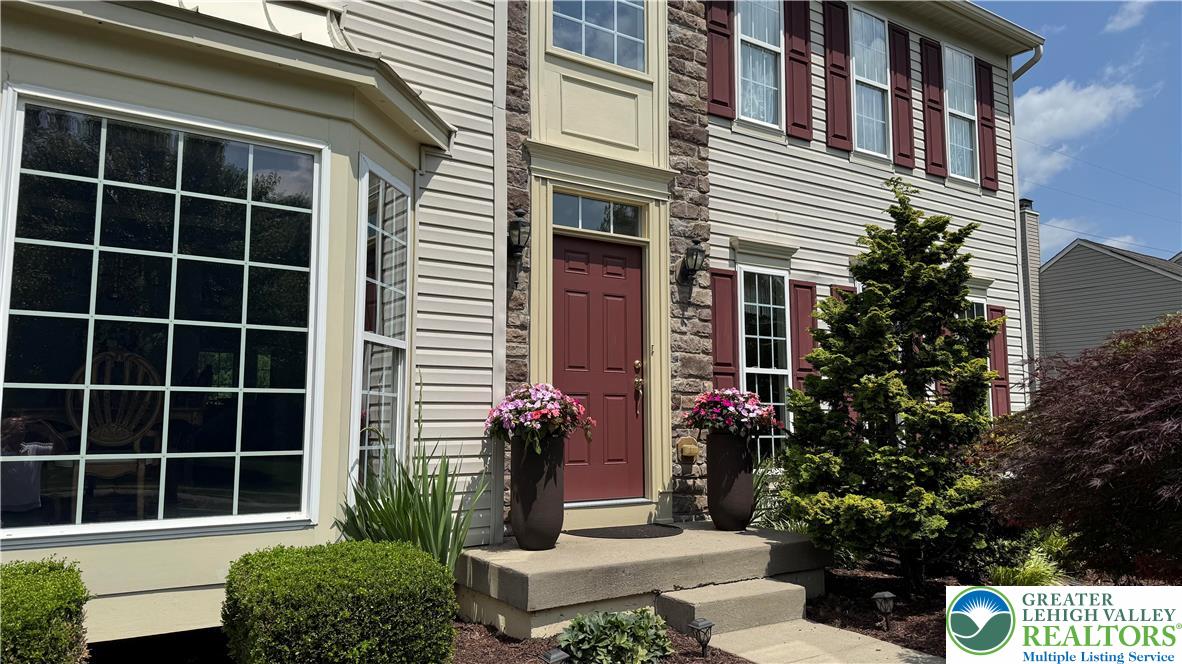 135 Clover Hollow Road Easton, PA 18045 - Photo 8 of 66 a front view of a house with a garden