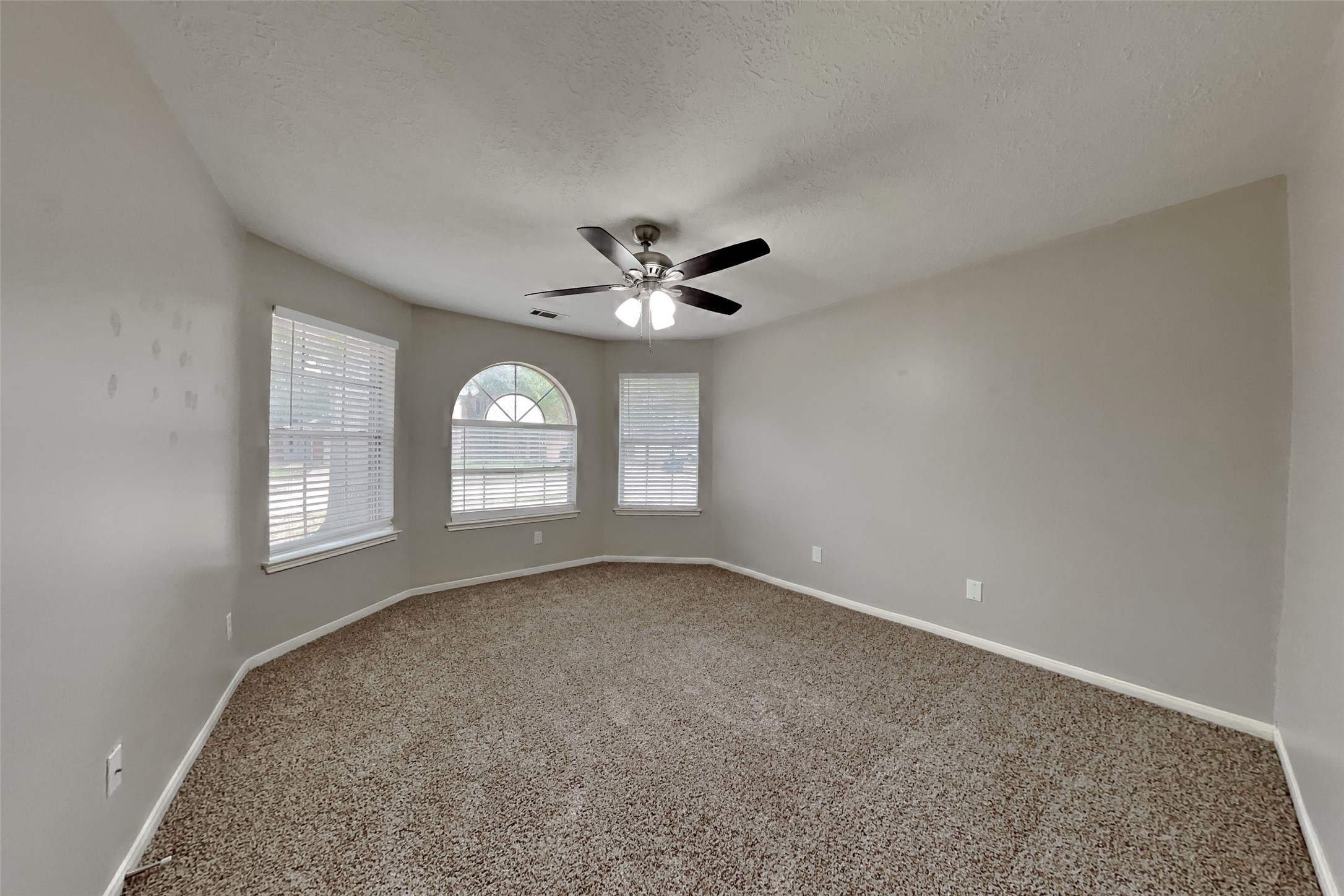 3413 Jan Court Katy, TX 77493 - Photo 12 of 18 a view of a livingroom with a ceiling fan and window