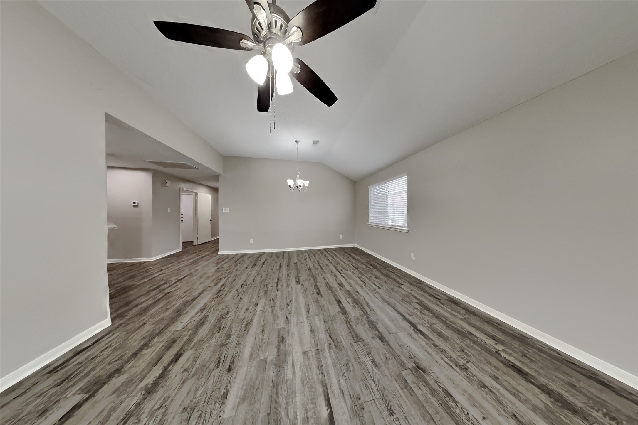 3413 Jan Court Katy, TX 77493 - Photo 2 of 18 wooden floor in an empty room with a window