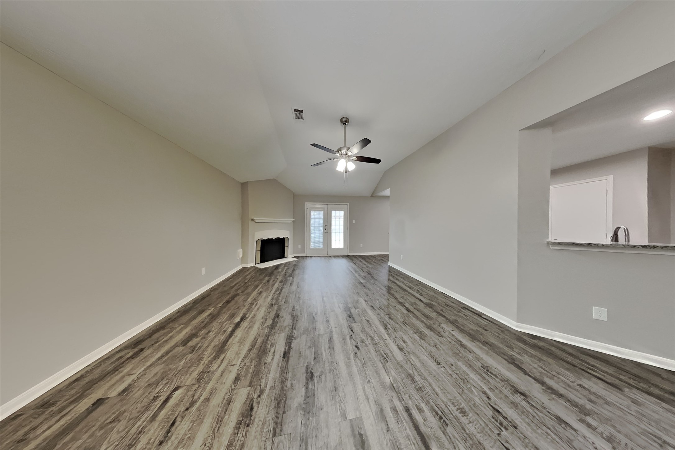 3413 Jan Court Katy, TX 77493 - Photo 6 of 18 a view of empty room with wooden floor and fan