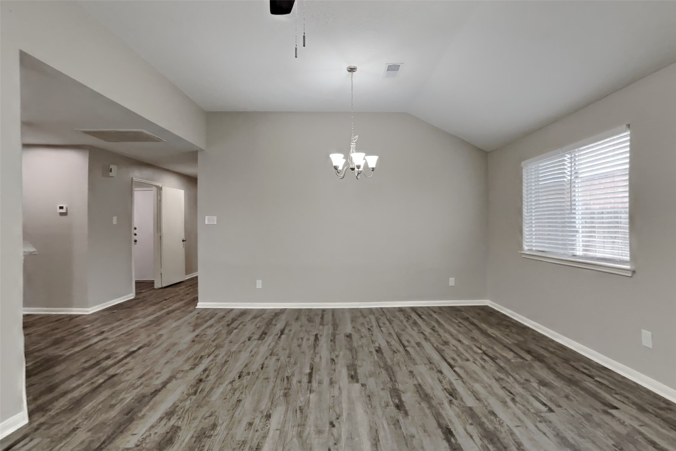 3413 Jan Court Katy, TX 77493 - Photo 7 of 18 wooden floor in an empty room with a window