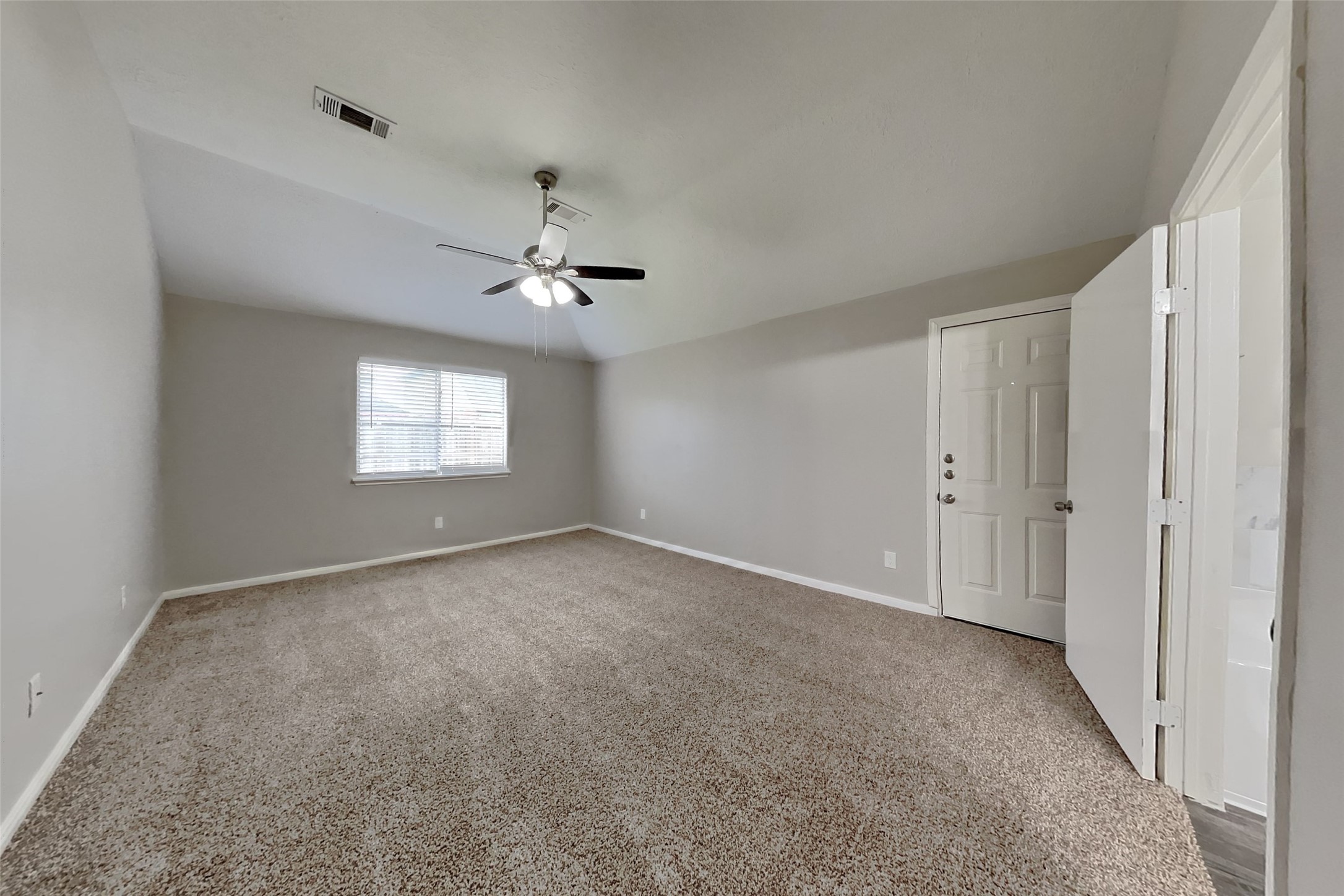3413 Jan Court Katy, TX 77493 - Photo 9 of 18 a view of an empty room with a ceiling fan