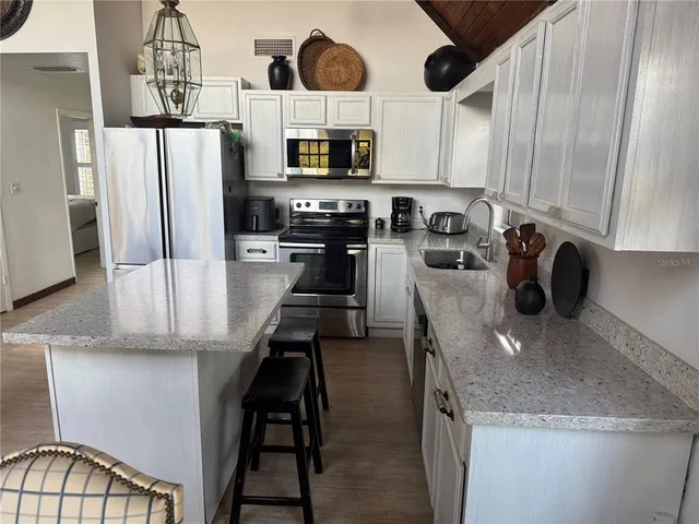a view of a porch with a hanging from a ceiling window