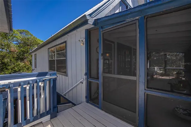 a view of a lake with a house in the background