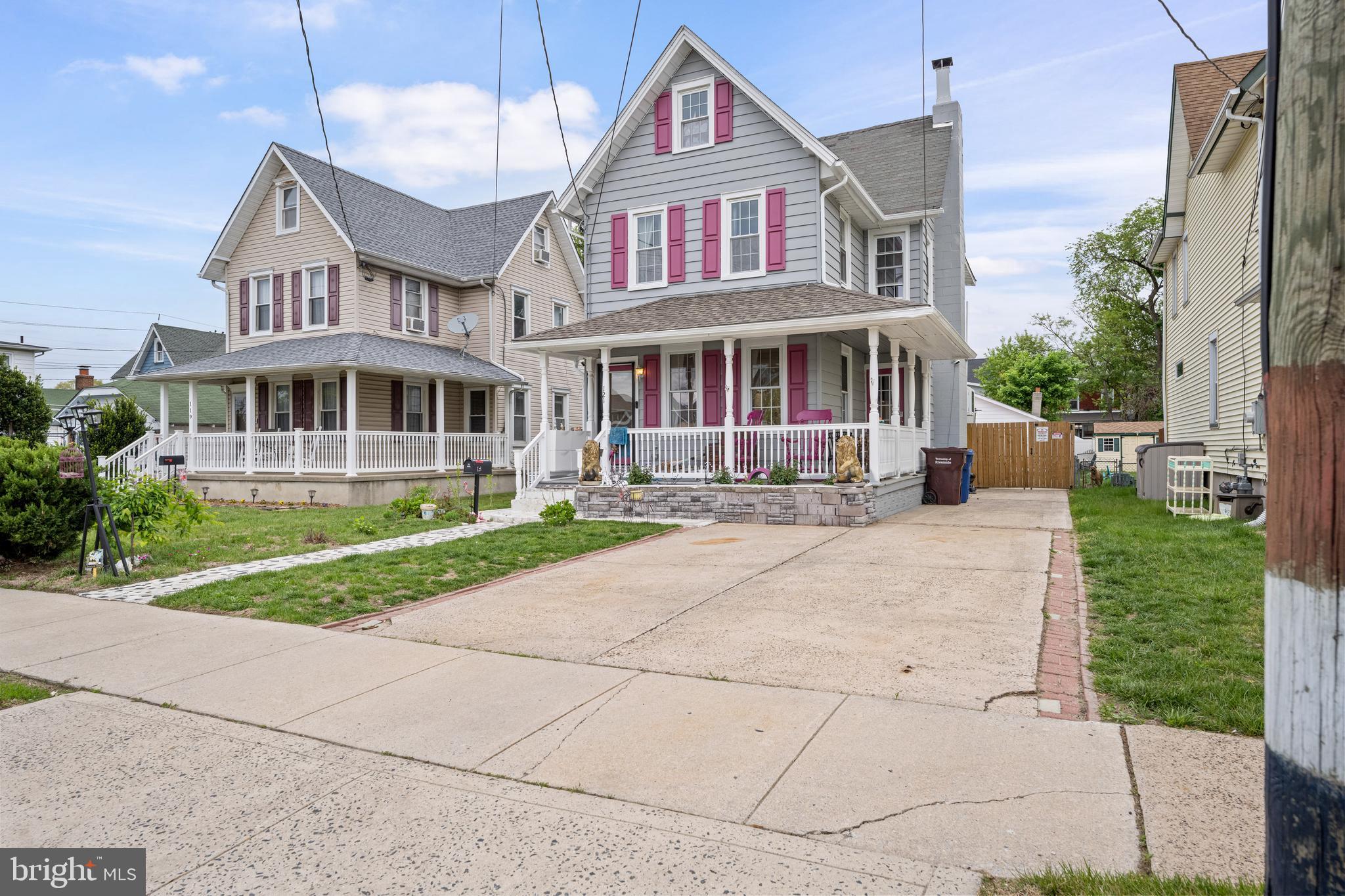 121 Cleveland Avenue Riverside, NJ 08075 - Photo 1 of 35 a front view of a house with a yard table and chairs