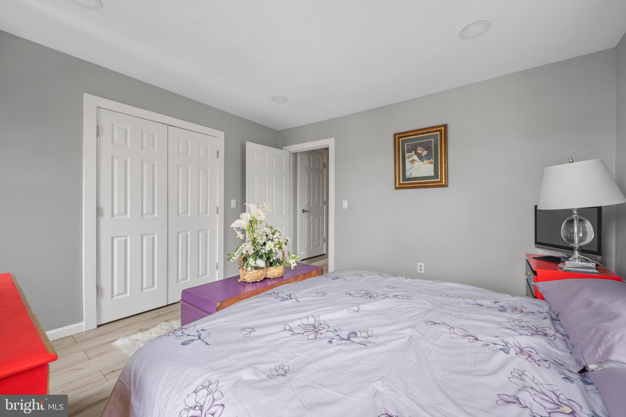 121 Cleveland Avenue Riverside, NJ 08075 - Photo 16 of 35 a bedroom with a bed and a chandelier