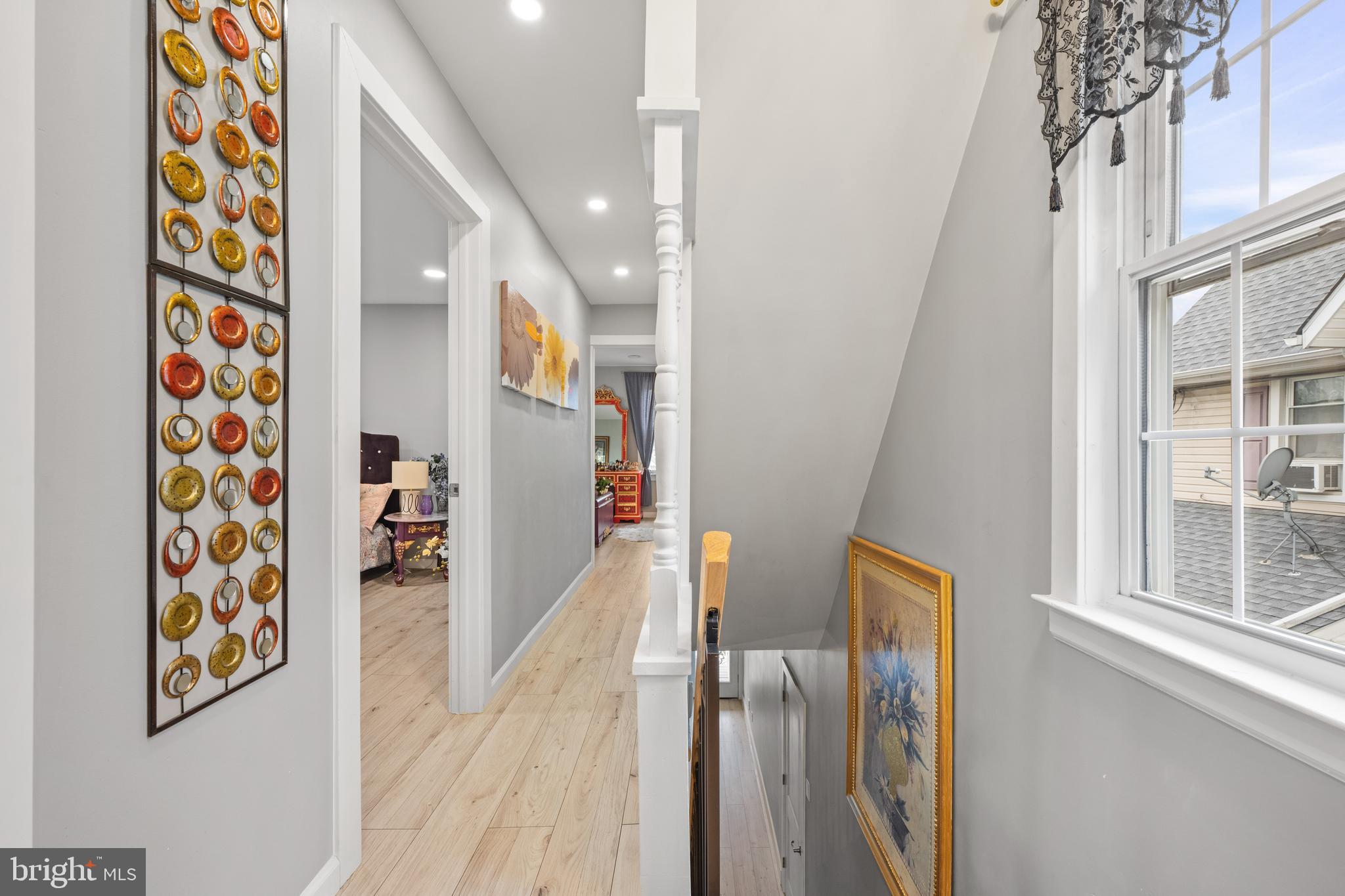 121 Cleveland Avenue Riverside, NJ 08075 - Photo 23 of 35 a view of a hallway with wooden floor and staircase