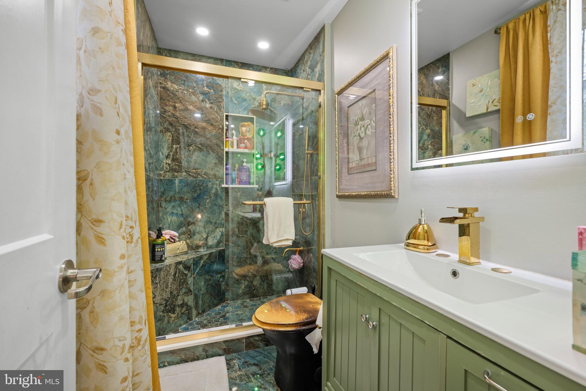 121 Cleveland Avenue Riverside, NJ 08075 - Photo 24 of 35 a bathroom with a sink toilet and shower