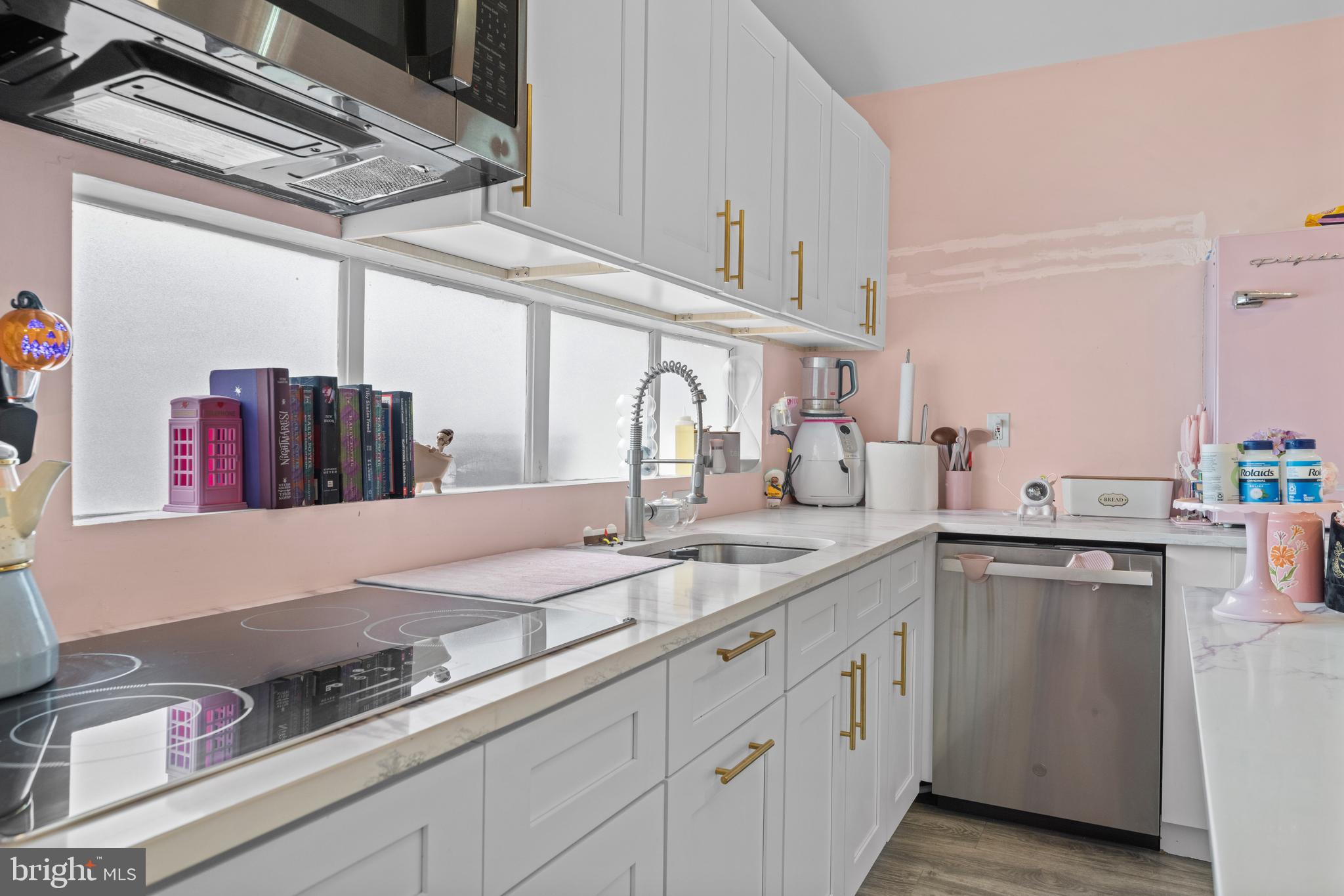 121 Cleveland Avenue Riverside, NJ 08075 - Photo 28 of 35 a kitchen with stainless steel appliances a sink stove and cabinets