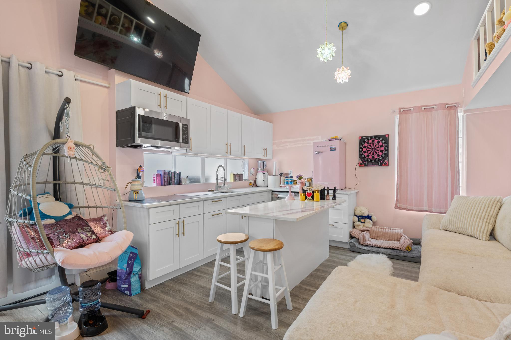 121 Cleveland Avenue Riverside, NJ 08075 - Photo 30 of 35 a kitchen with a dining table chairs and flat screen tv