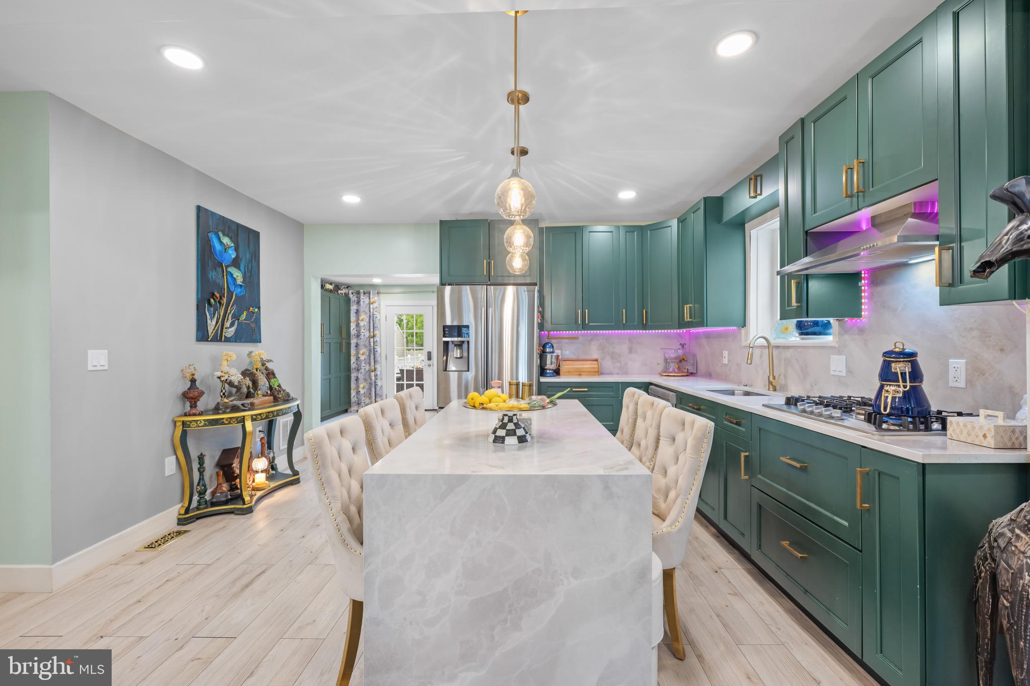 121 Cleveland Avenue Riverside, NJ 08075 - Photo 7 of 35 a dining hall with stainless steel appliances kitchen island granite countertop a sink a counter space and a view of living room
