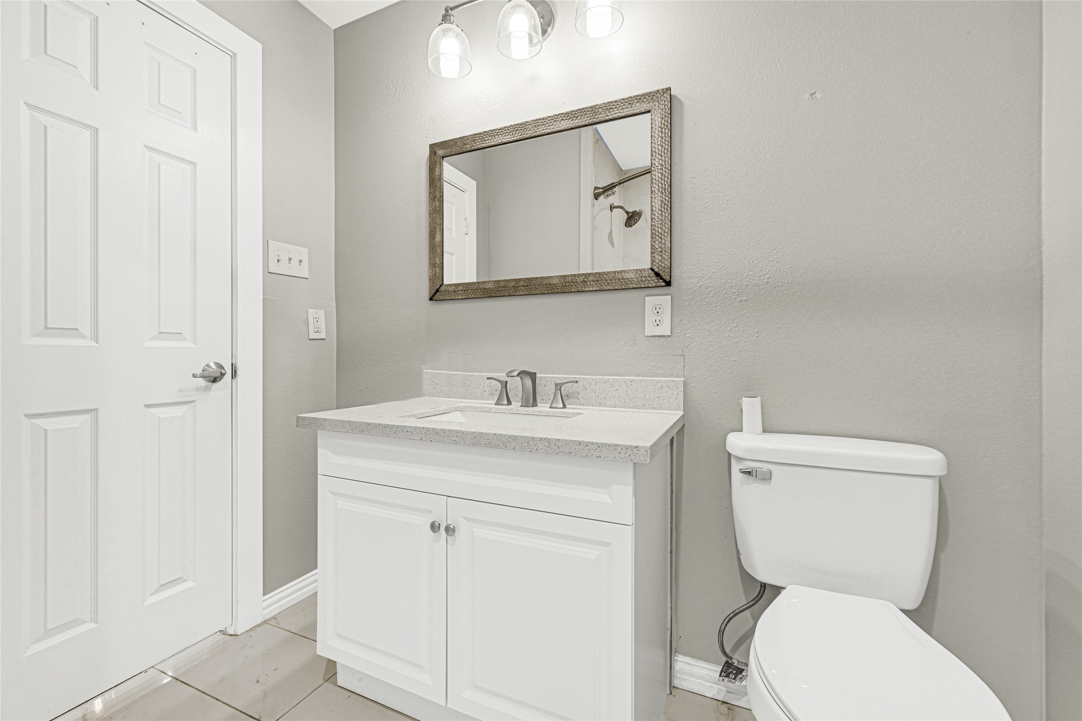 4326 Alconbury Lane, Unit 8 Houston, TX 77021 - Photo 15 of 28 a bathroom with a toilet sink and mirror