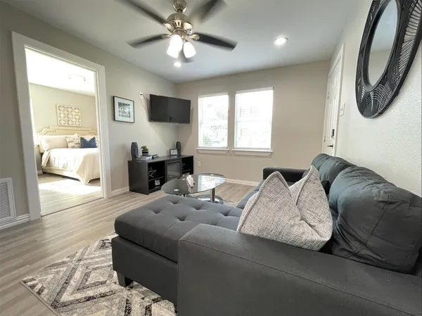 a living room with furniture and a large window