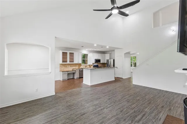a view of a kitchen with a sink cabinets and wooden floor