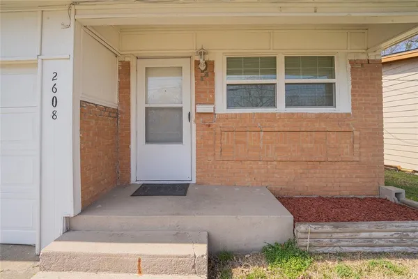 a view of a house with a street