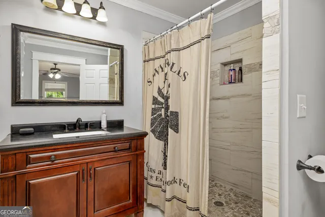 a bathroom with a sink a mirror and a shower