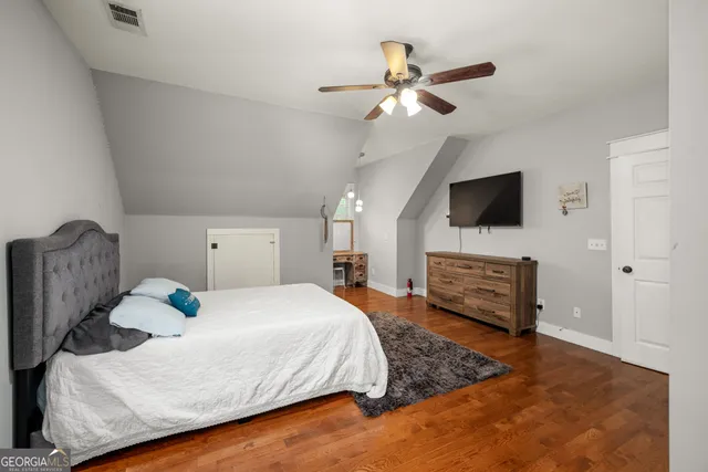a living room with fireplace furniture and a flat screen tv