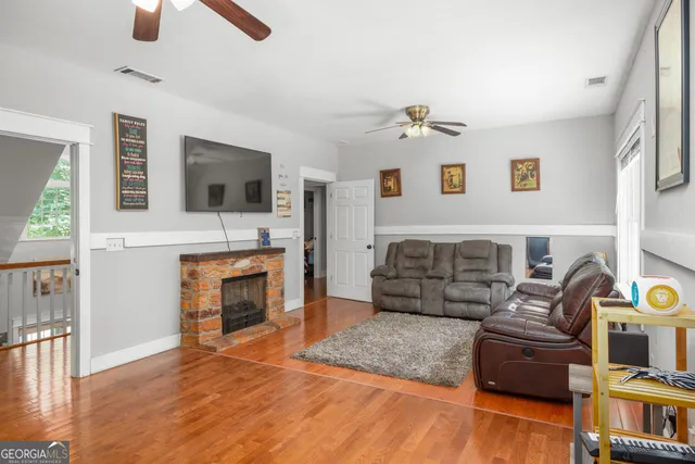 a bedroom with a bed chandelier and a window