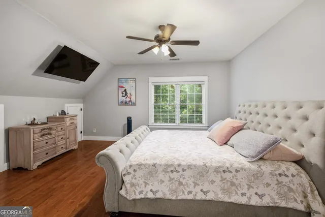 a bathroom with a granite countertop sink mirror and shower