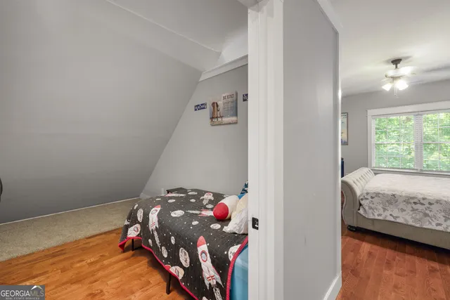 a kitchen with stainless steel appliances granite countertop counter space and chairs in it