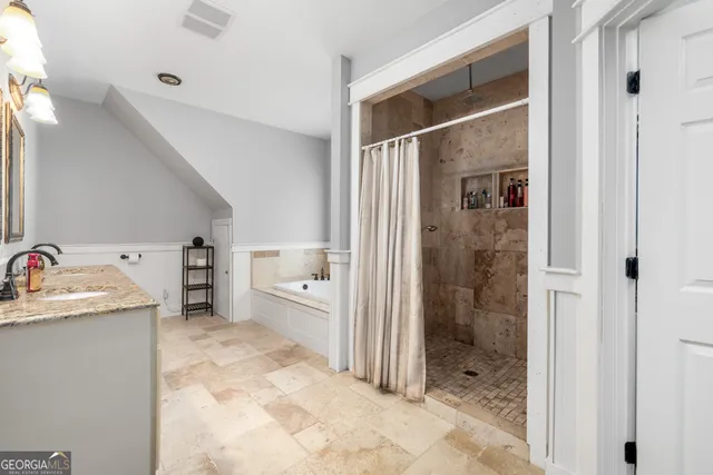 a view of a house with backyard and a tree