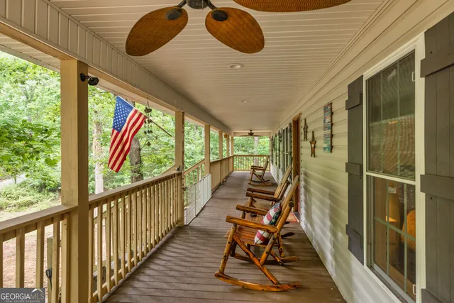a view of a house with a yard patio and swimming pool