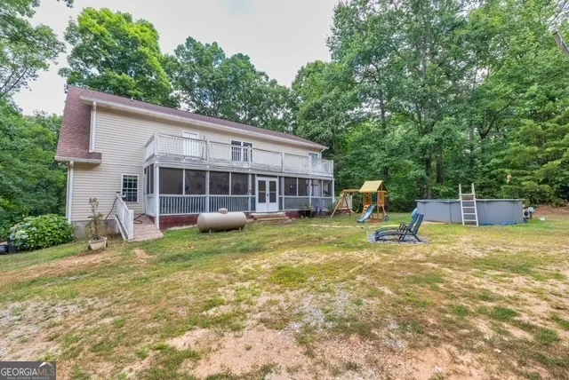 a view of an chairs and table in the balcony