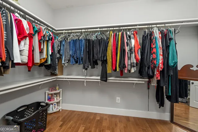 a view of a house with a yard balcony and sitting area