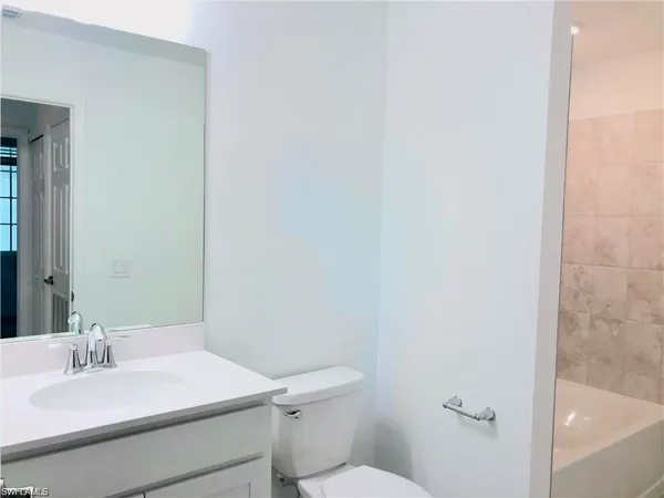 a bathroom with a sink and a toilet