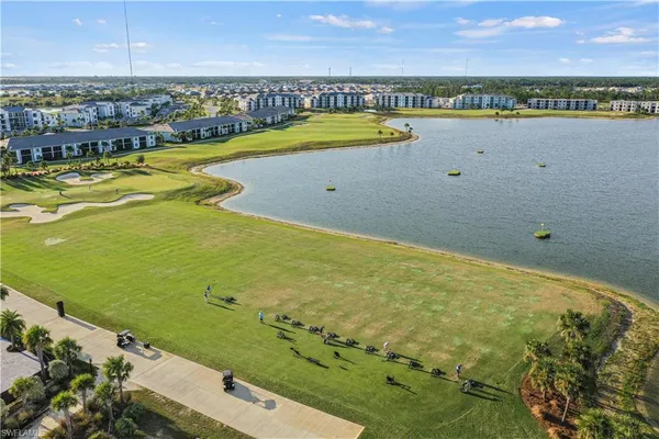 a view of a swimming pool and an outdoor seating