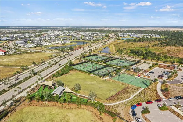 an aerial view of a city with an ocean