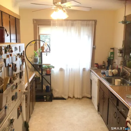 a view of a bathroom with a sink and a mirror