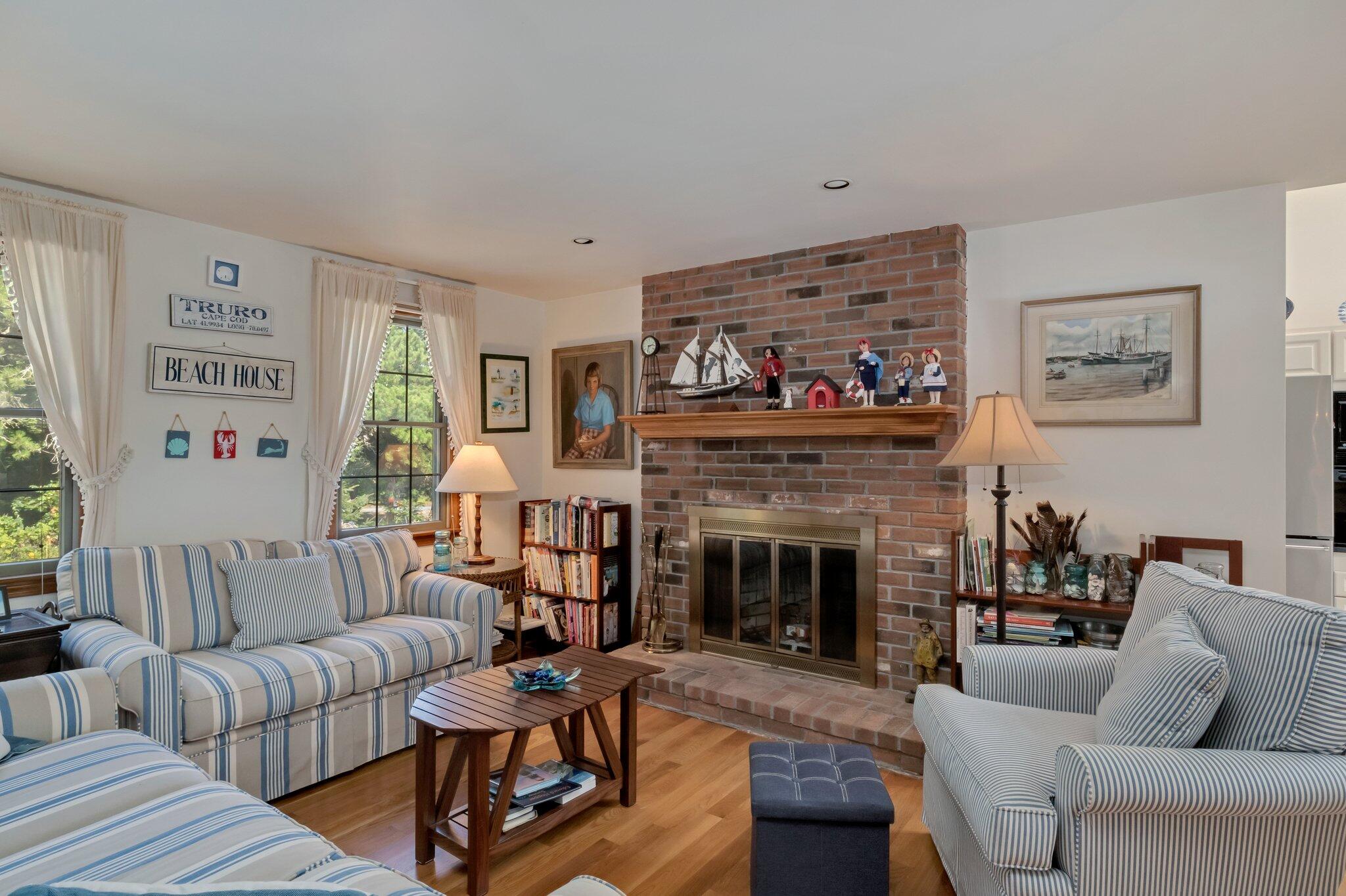 106 Castle Road Truro, MA 02666 - Photo 13 of 47 a living room with furniture and a fireplace