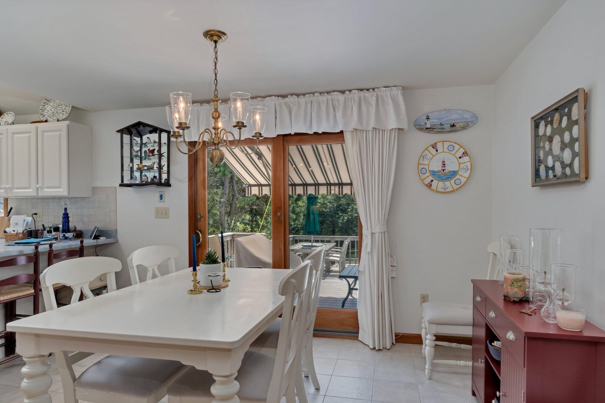 106 Castle Road Truro, MA 02666 - Photo 20 of 47 a view of a dining room with furniture window and outside view