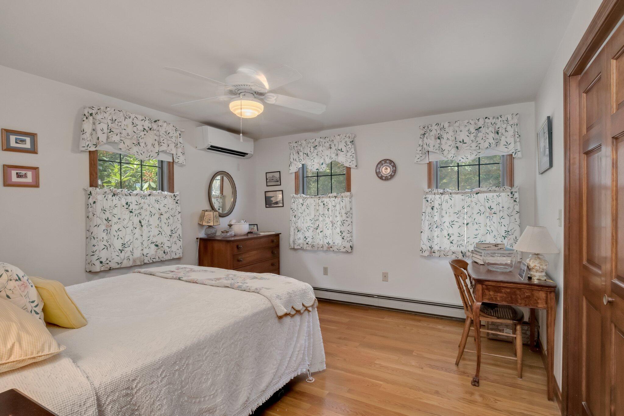 106 Castle Road Truro, MA 02666 - Photo 25 of 47 a bedroom with a bed and a table in it