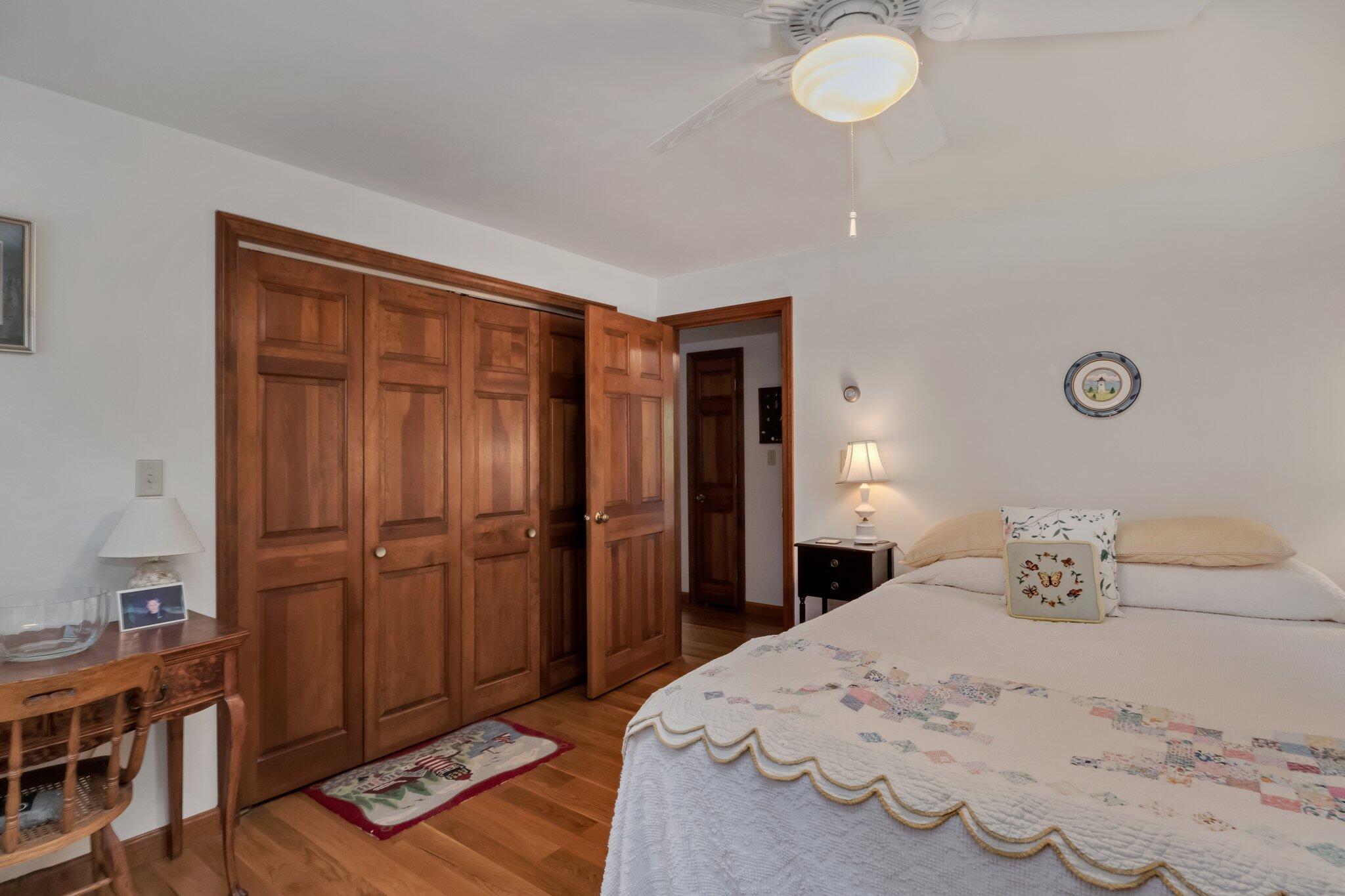 106 Castle Road Truro, MA 02666 - Photo 27 of 47 a bedroom with a bed and a desk