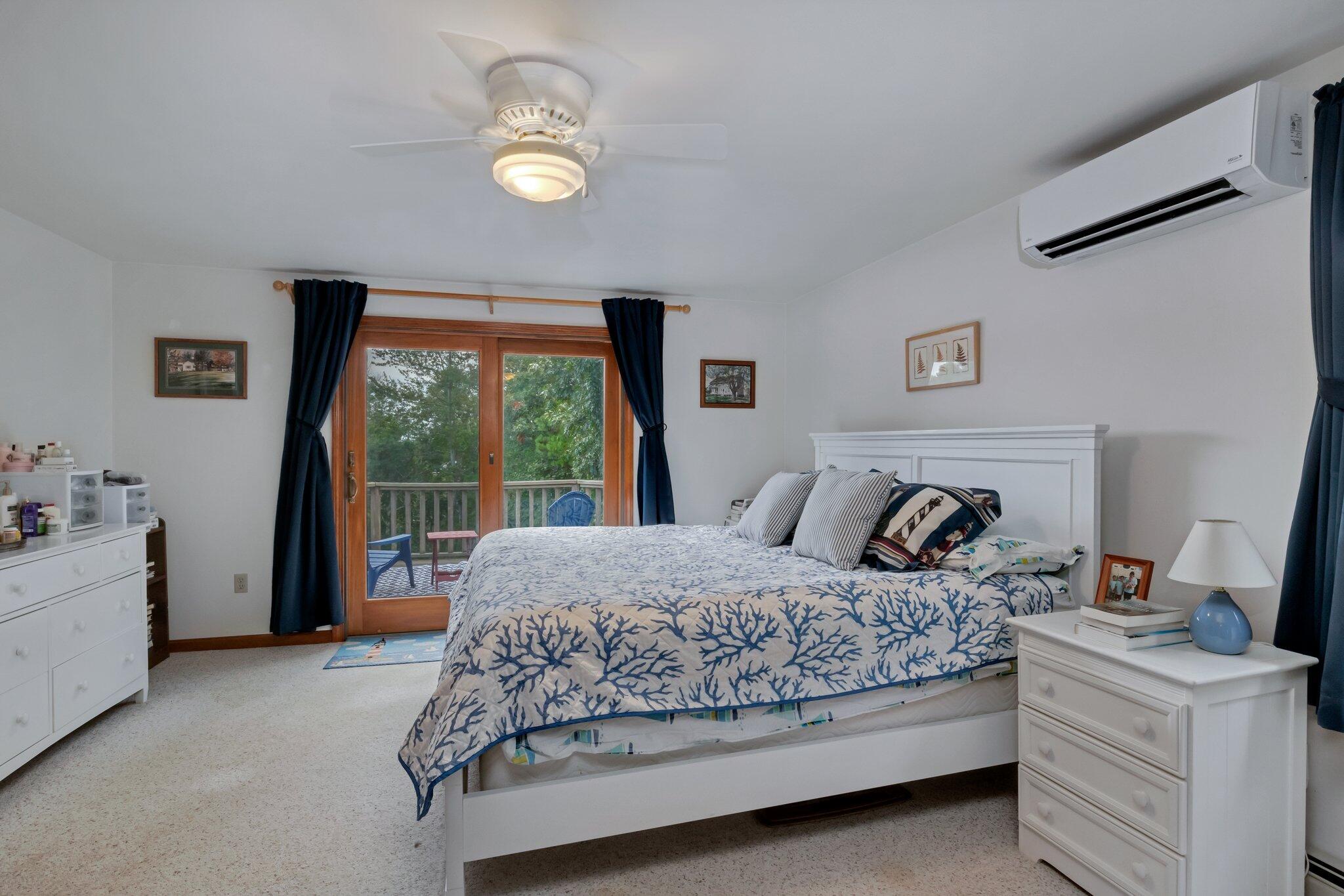 106 Castle Road Truro, MA 02666 - Photo 29 of 47 a bedroom with a bed and a large window