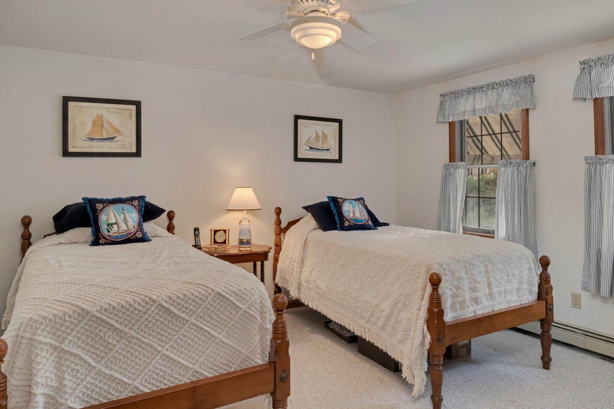 106 Castle Road Truro, MA 02666 - Photo 35 of 47 a bedroom with two beds and painting on the wall