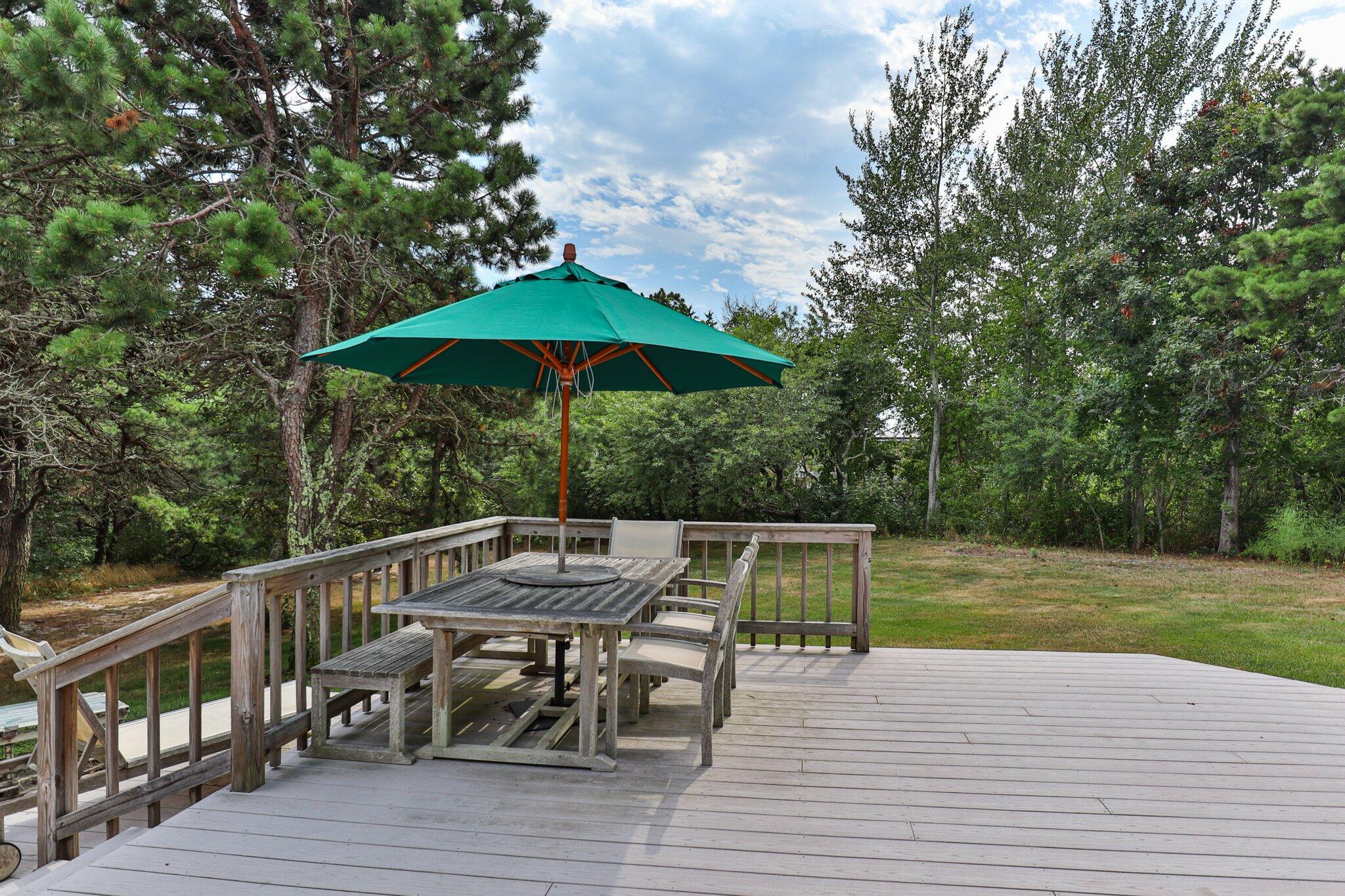 106 Castle Road Truro, MA 02666 - Photo 42 of 47 a view of backyard with seating space and trees